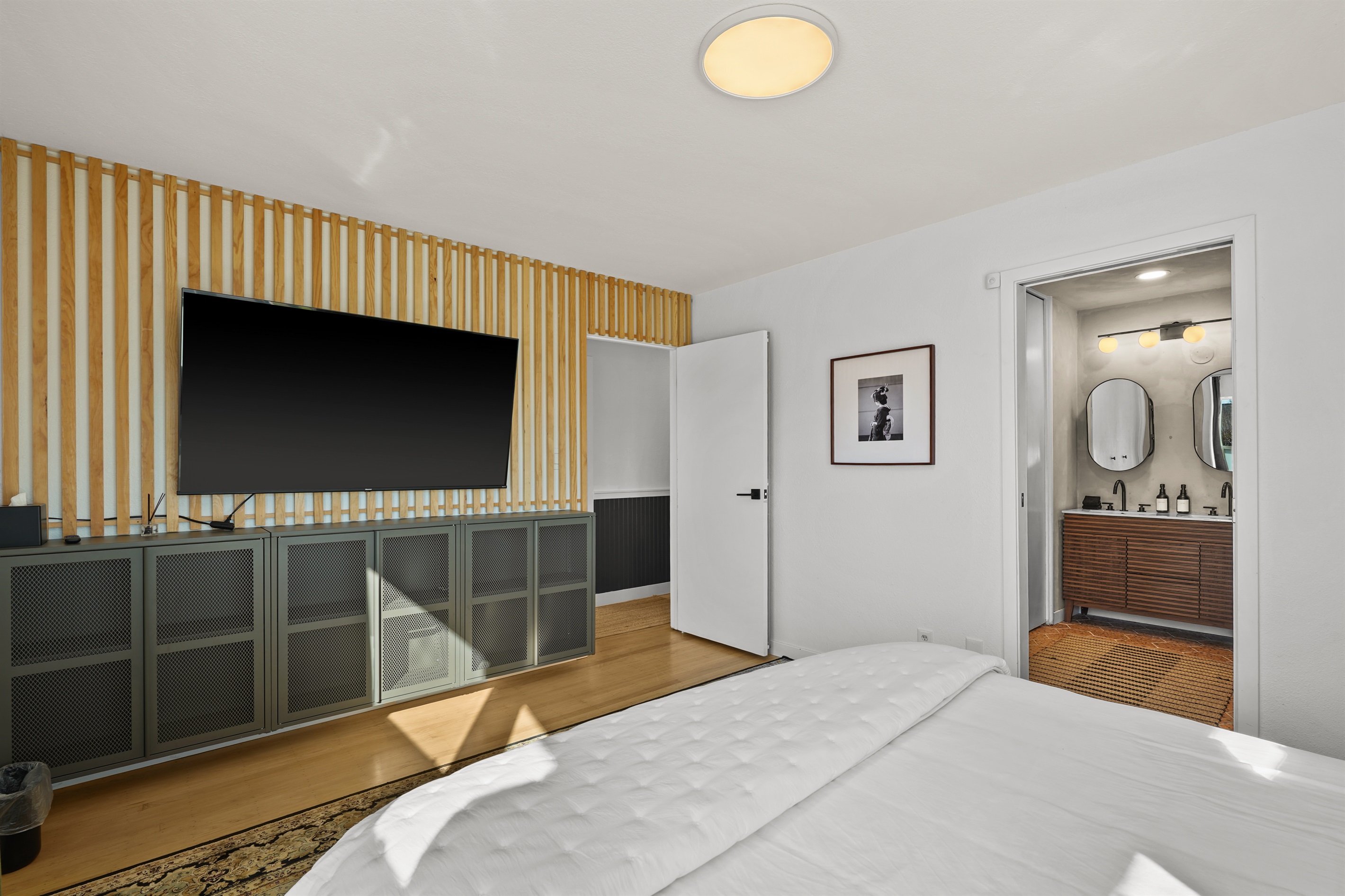 Spacious primary bedroom featuring a comfortable king bed, Smart TV, and plenty of room to relax after a day exploring Napa Valley.