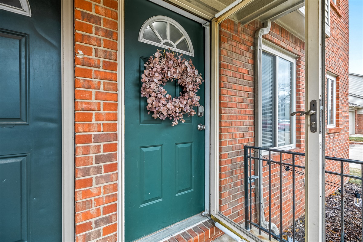 Inviting private entrance with a charming covered porch, setting the tone for a comfortable and welcoming stay.