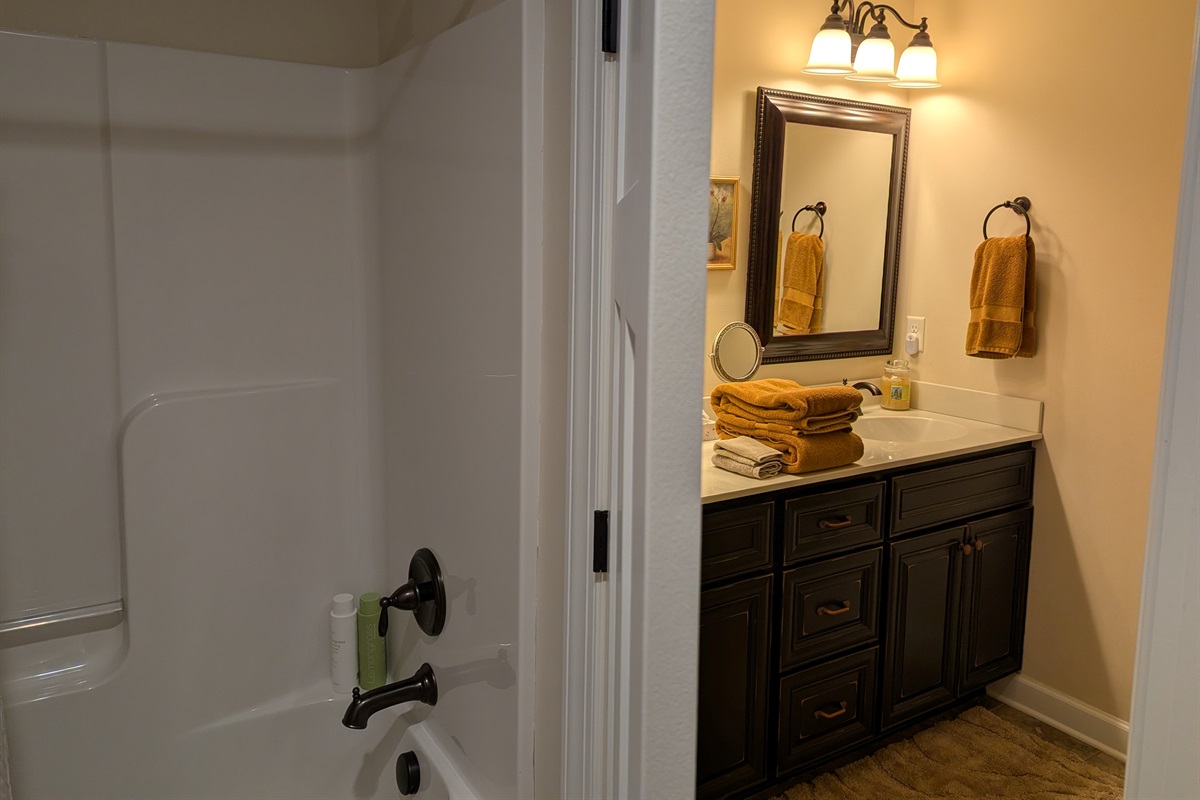 Second bathroom with double vanity and separate shower/ toilet room.