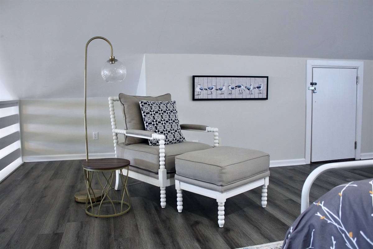Kick back with your favorite book or enjoy a peaceful moment in this inviting loft nook.