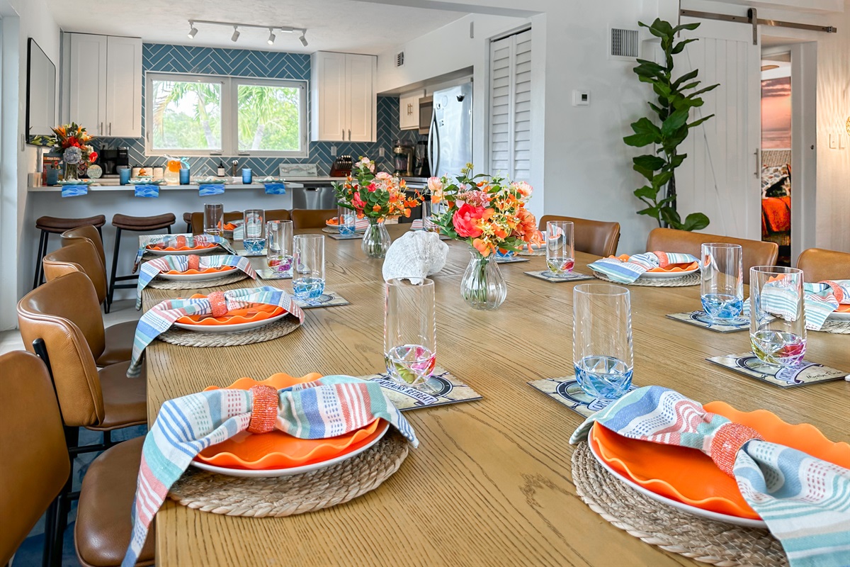 The large dining table seats 12 people with 2 on each end.