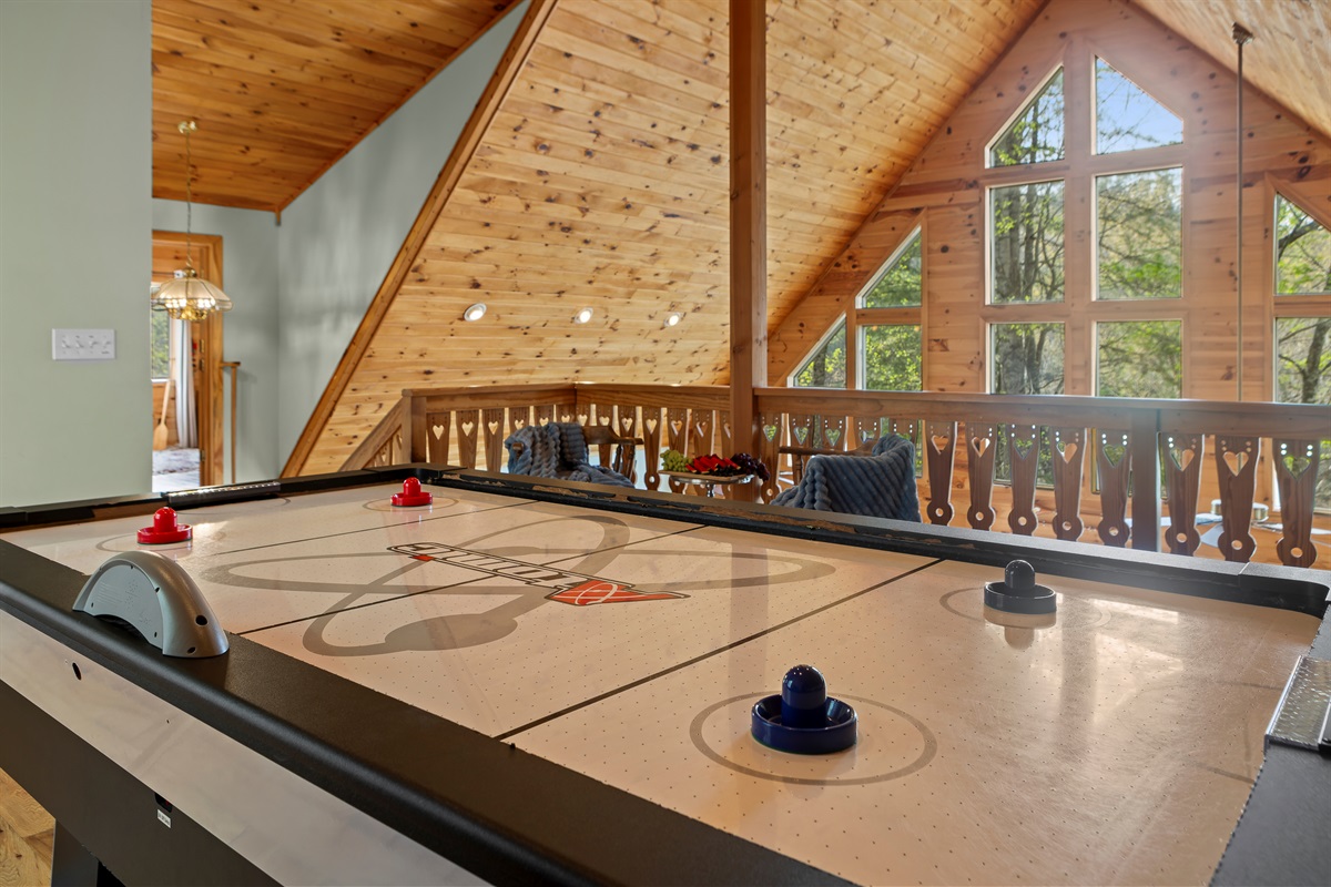 Game Area: Challenge friends to air hockey in this spacious, sunlit retreat with stunning views!