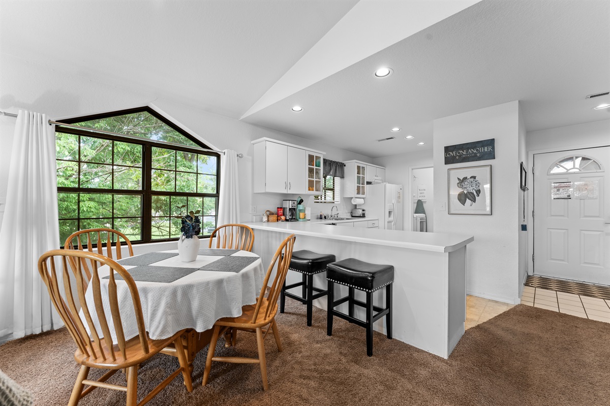 Dining nook beside the big windows gives you a bright spot for breakfast, cards, or a casual dinner in.