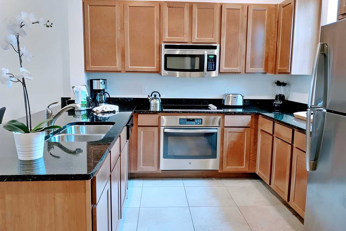 The kitchen is equipped with modern appliances