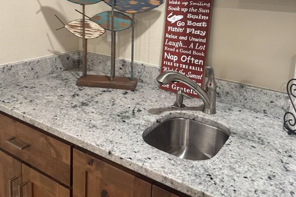 Lower level Bar Sink above Beverage Fridge