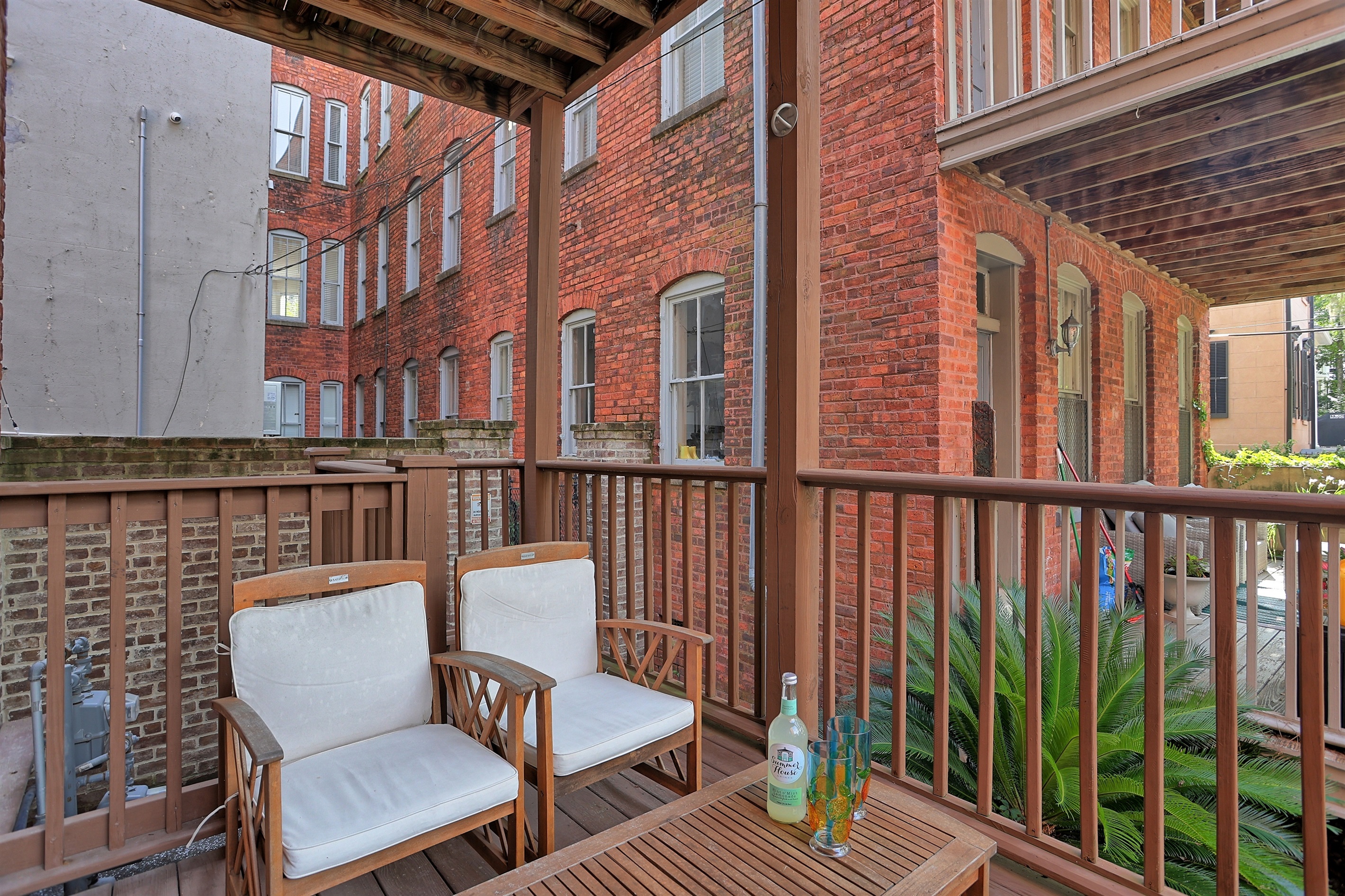 A cozy covered porch with plenty of room for friends or family to gather.