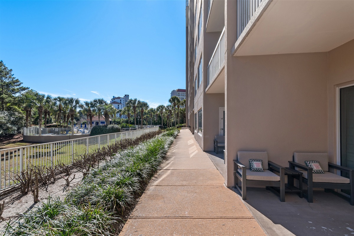 Covered Patio with comfortable seating - just a short walk to the Tops'l Summit Pool and Beach Access!