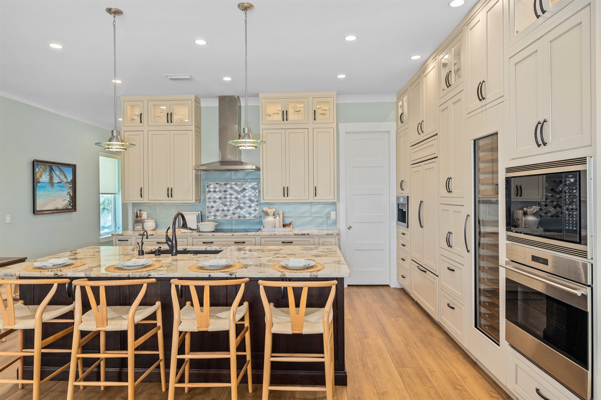 Bright, gourmet, fully equipped kitchen with large island seating 