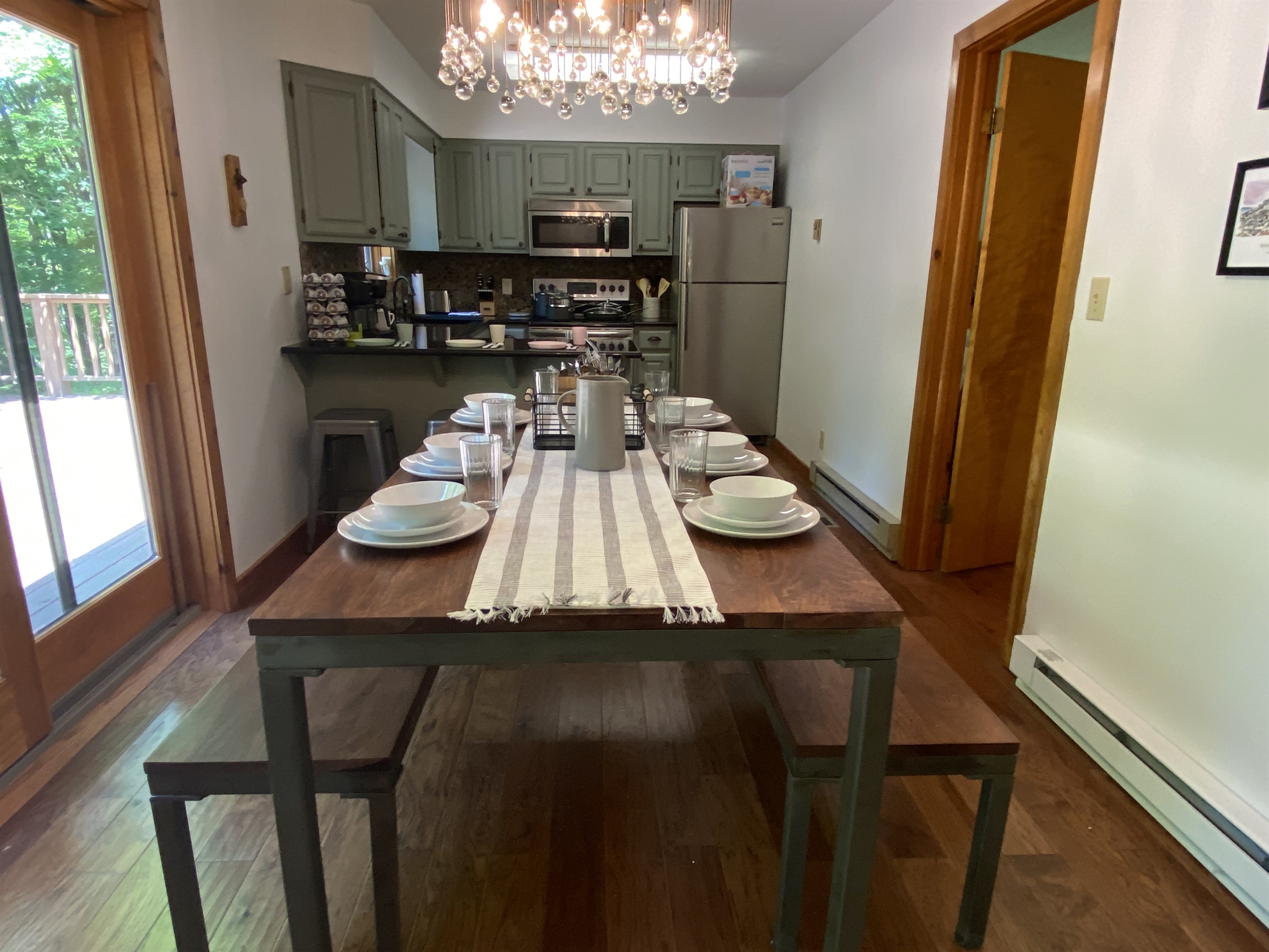 Open dining table to kitchen.  