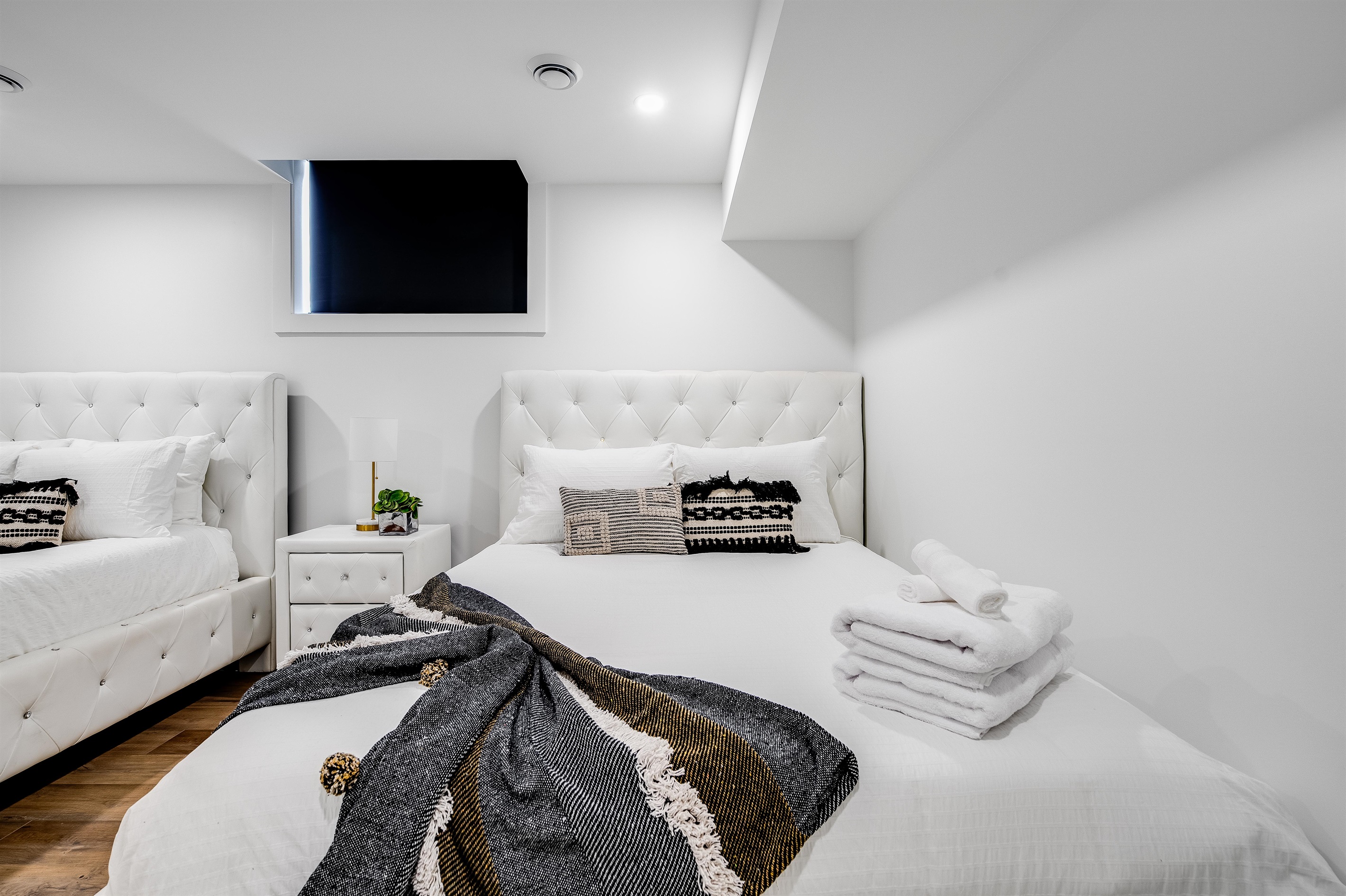 Lower level bedroom with two queen beds.