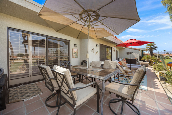 Spacious back patio with ample seating