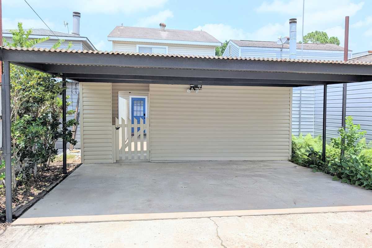 A dedicated carport for two cars is provided, with additional free street parking available at the front of the home.