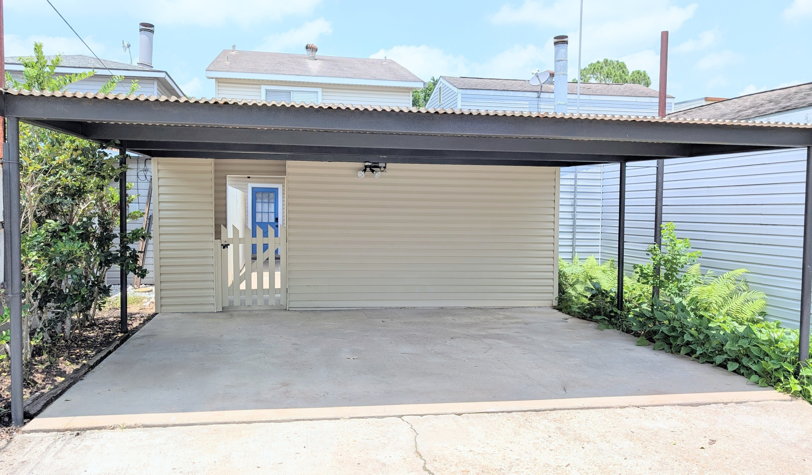 A dedicated carport for two cars is provided, with additional free street parking available at the front of the home.