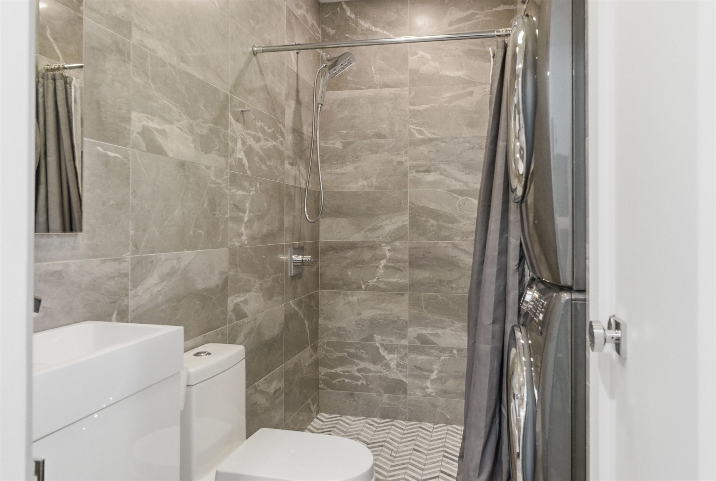 Hallway Bath - Laundry Stacked Washer and Dryer