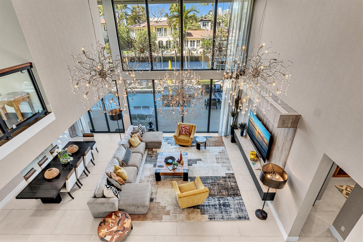 Spacious luxury living room with upscale décor, generous seating, and large Smart TV — ideal for group stays and elevated entertaining.