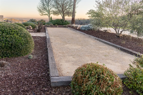 Grab a glass of wine and challenge your travel companions to a match. The hilltop bocce court is tucked into the native landscaping with the Paso Robles hills glowing at golden hour behind you.