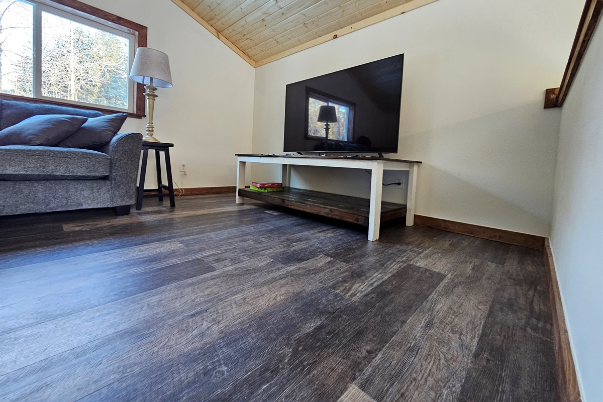 Loft (cabin is still being furnished, living room furniture will vary but each will include a trundle bed, couch, and TV).