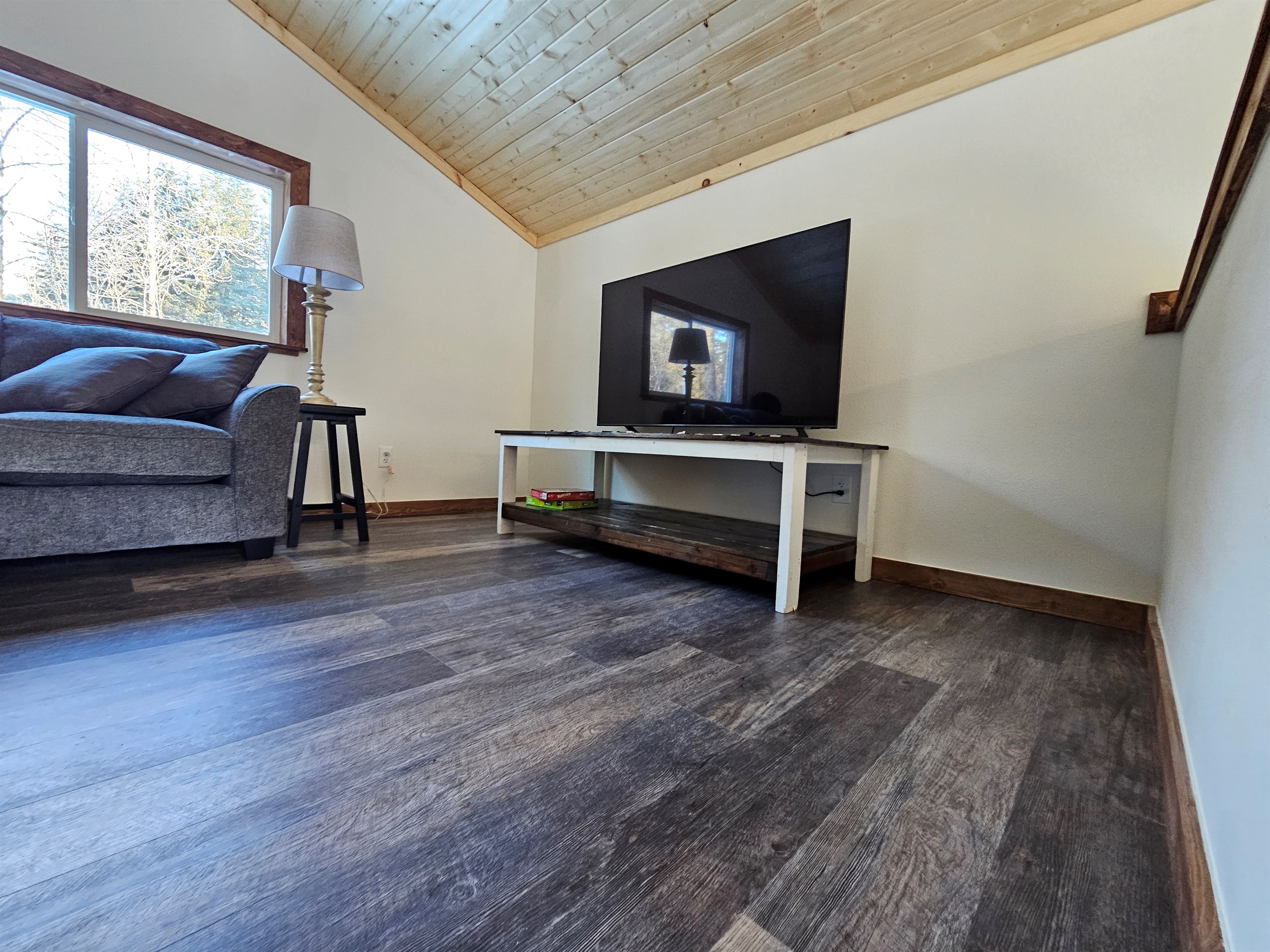 Loft (cabin is still being furnished, living room furniture will vary but each will include a trundle bed, couch, and TV).