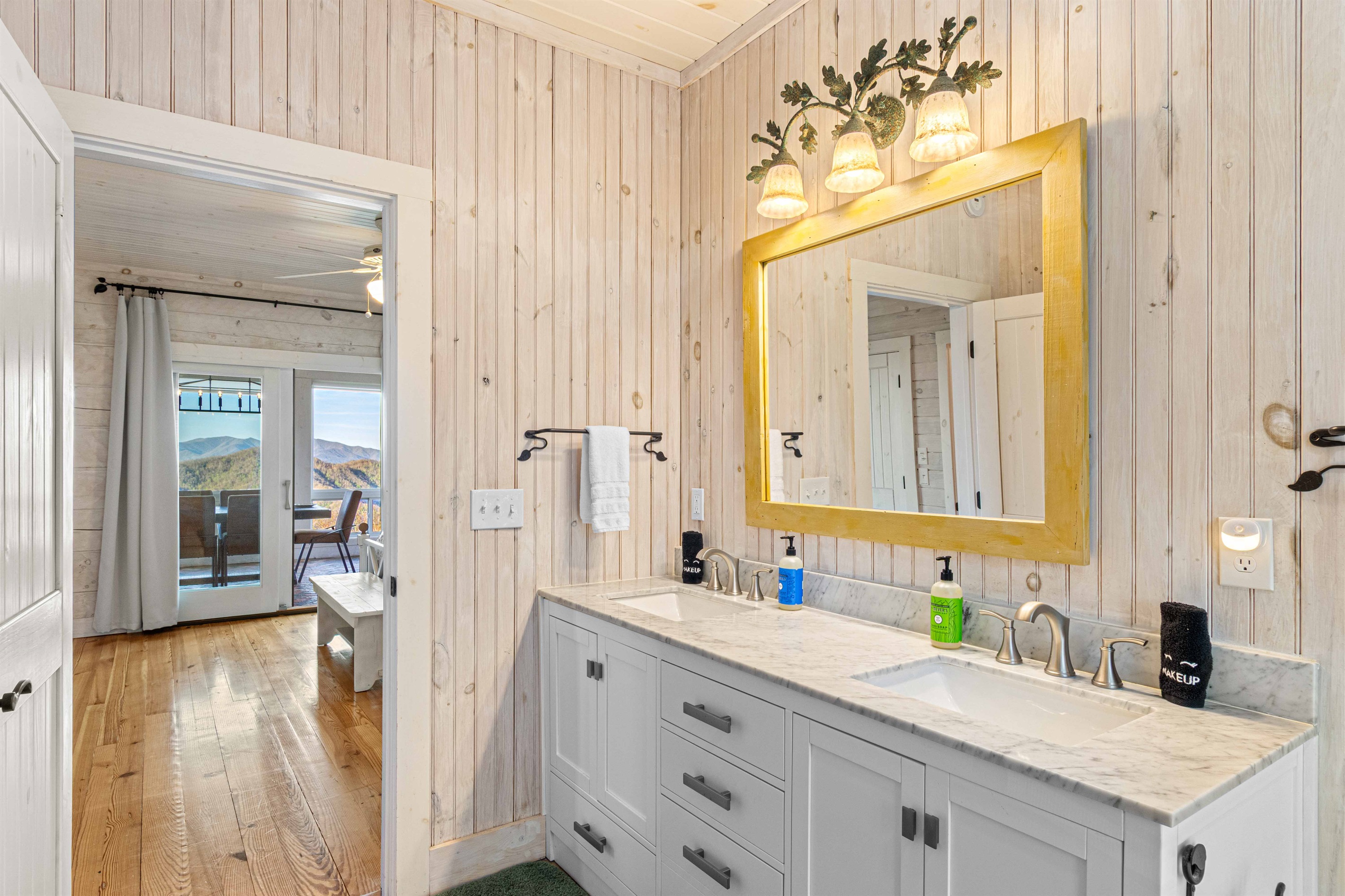 Full Bathroom 1: Bright space with a double vanity and stunning mountain views just outside!