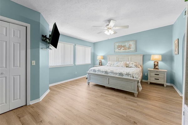 Bedroom #2 with king bed, ceiling fan, smart TV and ensuite bathroom