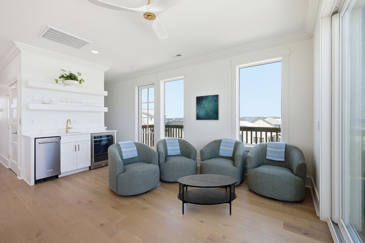 Second gathering lounge with relaxed seating and seamless indoor-outdoor flow for entertaining and unwinding