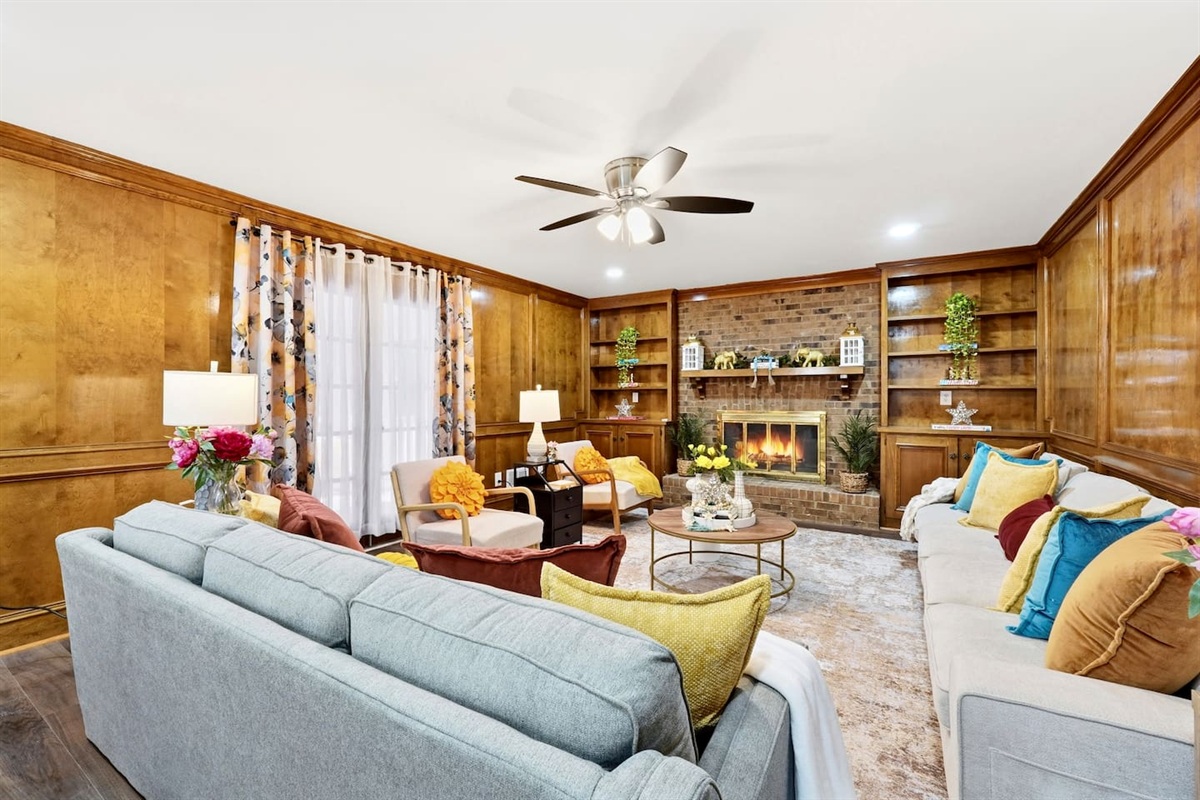 Enjoy a warm and inviting space featuring two comfortable couches and a charming fireplace perfect for relaxing, chatting, or unwinding after a long day.