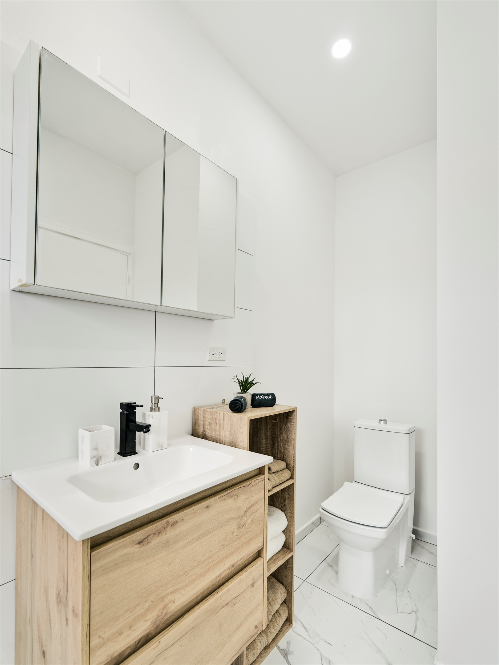 Modern Vanity with Sleek Sink & Warm Wood Cabinetry