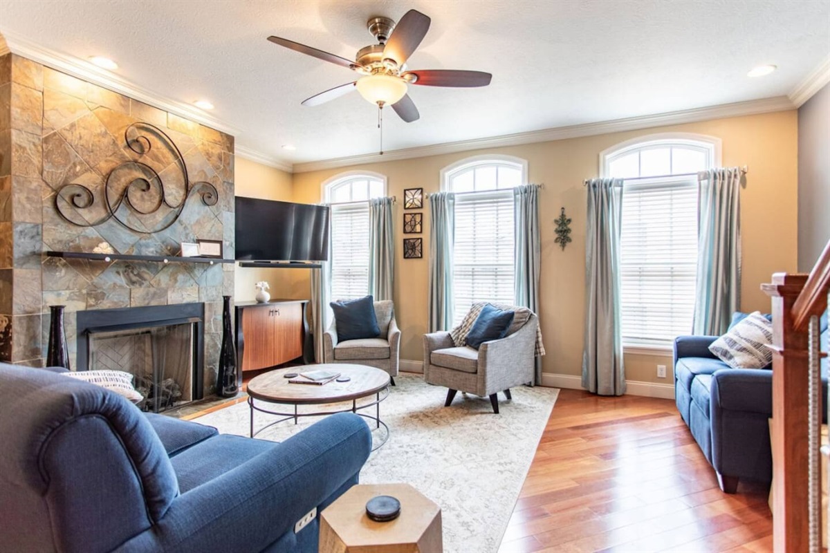 Cozy living area with large windows that flood the space with natural light, creating a bright and inviting atmosphere for relaxation.