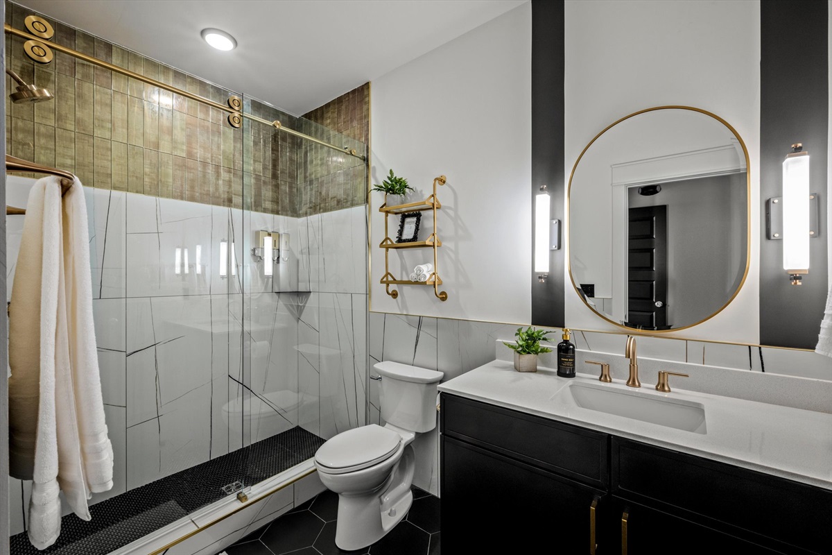 Unwind in your private en-suite sanctuary, complete with a refreshing walk-in shower designed for ultimate comfort and accessibility! 