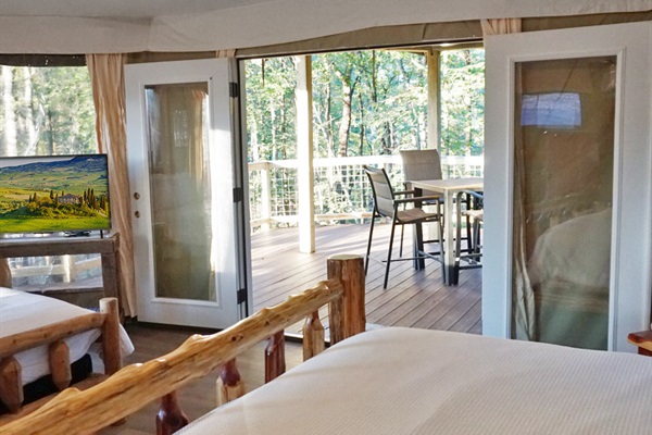 Rustic Retreat: Enjoy nature views from your private deck, blending comfort and adventure seamlessly!