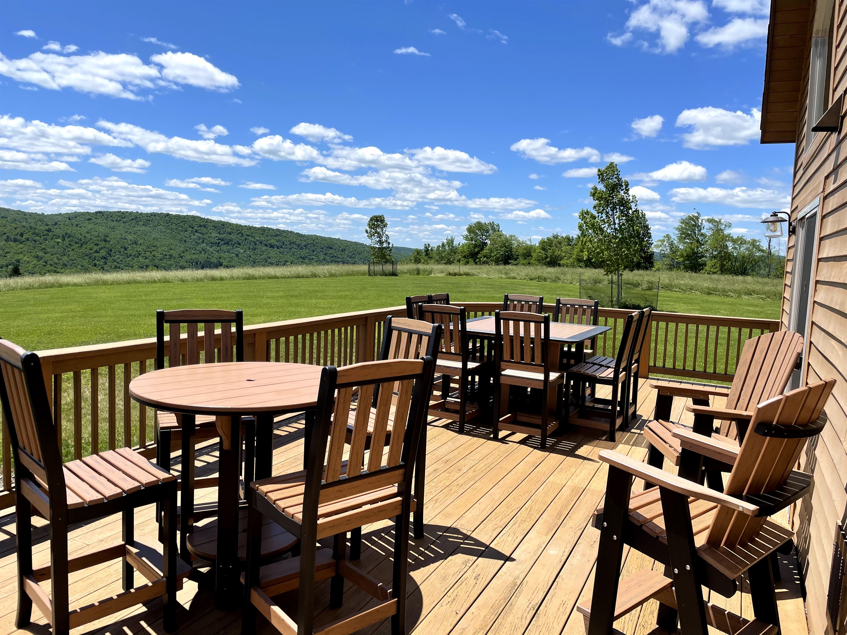 Sun soaked deck overlooking lawn.