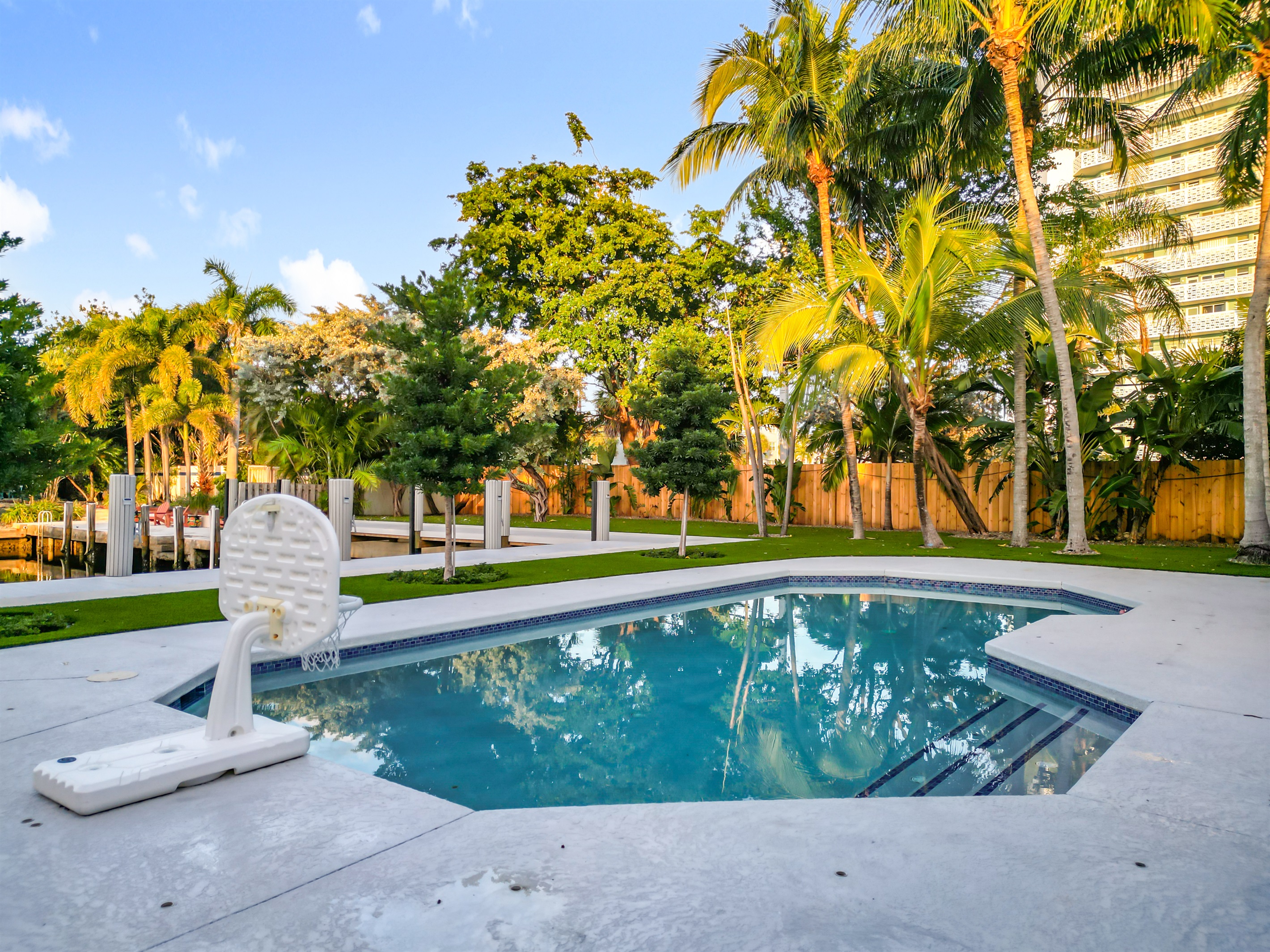 The backyard is large with a lot of space and areas to explore. The steps into the pool make entry easy