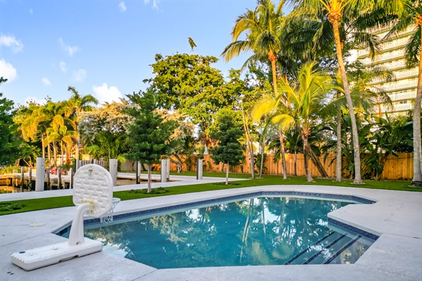 The backyard is large with a lot of space and areas to explore. The steps into the pool make entry easy