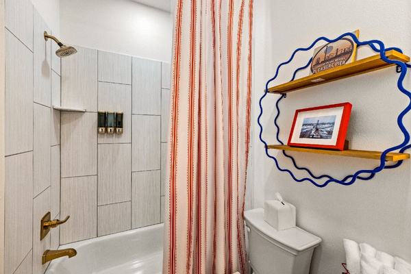 The Historic Pleasure Pier themed bathroom includes a tub/shower combo.