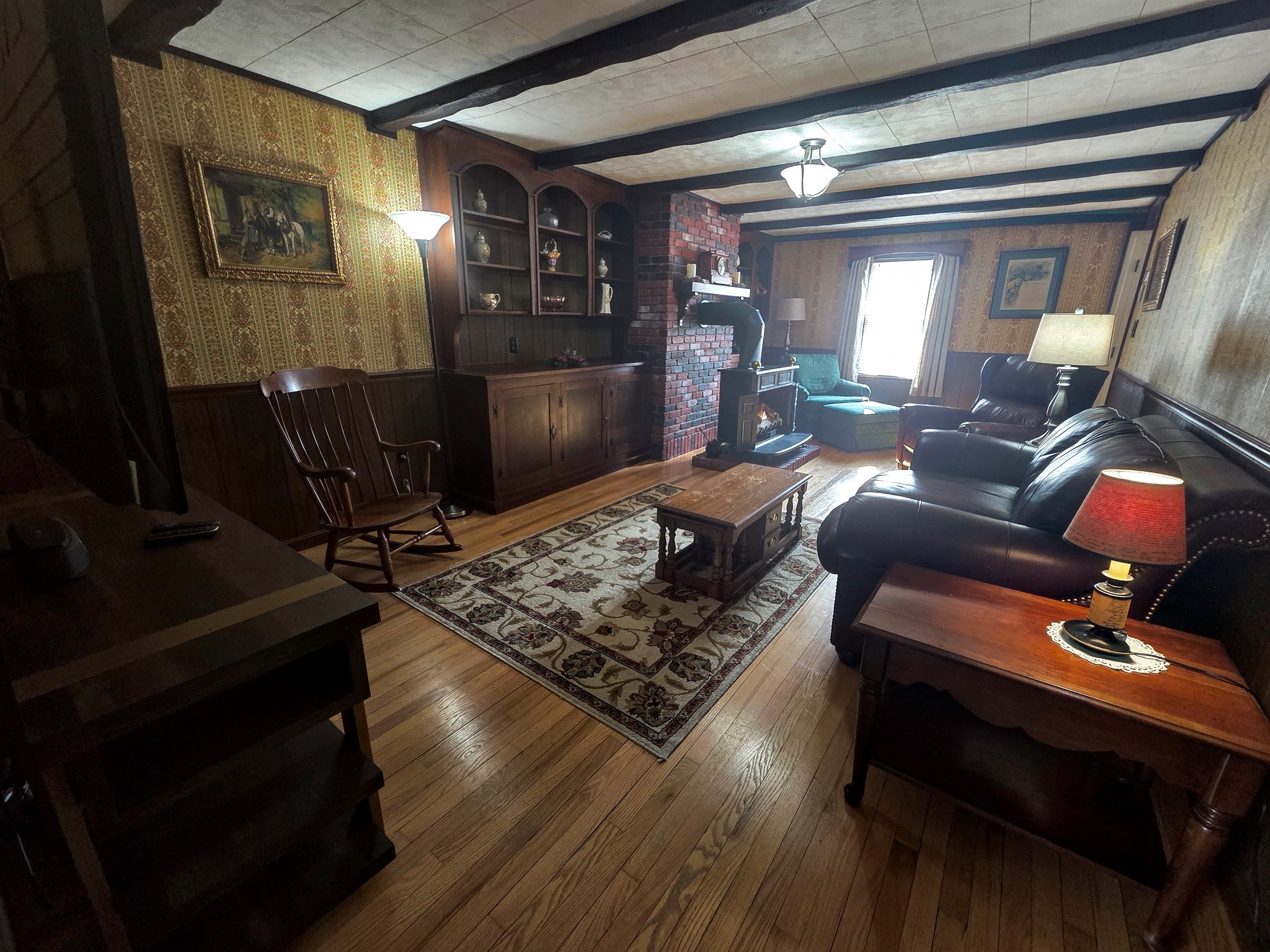 Relax in the rustic, cozy living room featuring a propane fireplace and Smart TV—perfect for unwinding after a day of exploring.