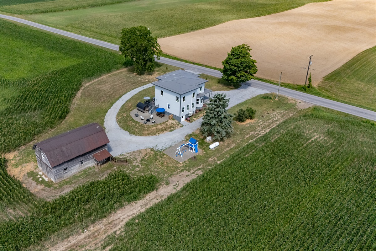 A perfect blend of modern living and rustic charm—updated 1817 home with a barn(off limits to guests) and outdoor space set in lush farmland.