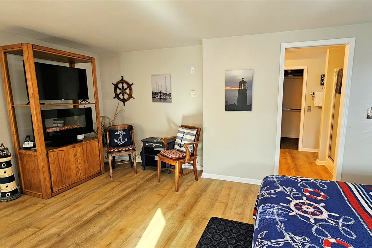 TV & Sitting area in front of TV and Electric Fireplace.