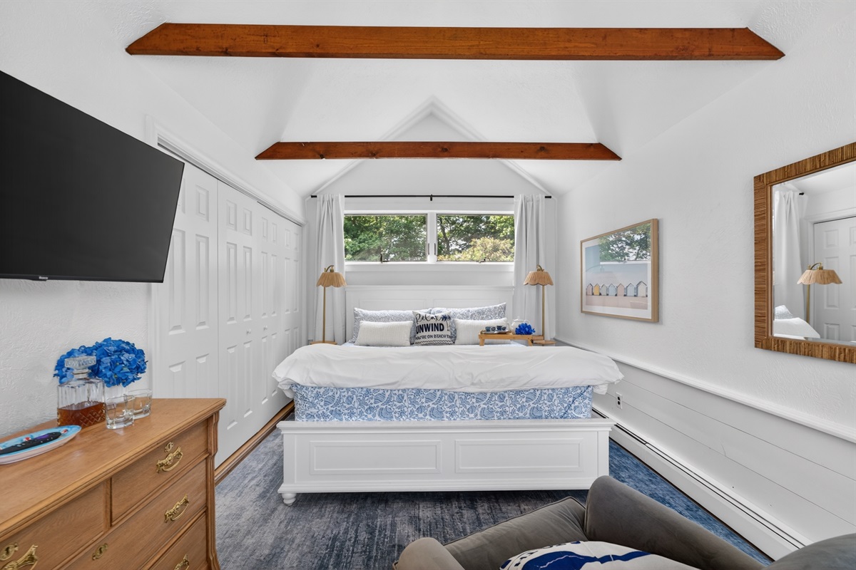 First-floor king suite with private attached bathroom and blackout shades, ideal for stair-free comfort and restful stays.