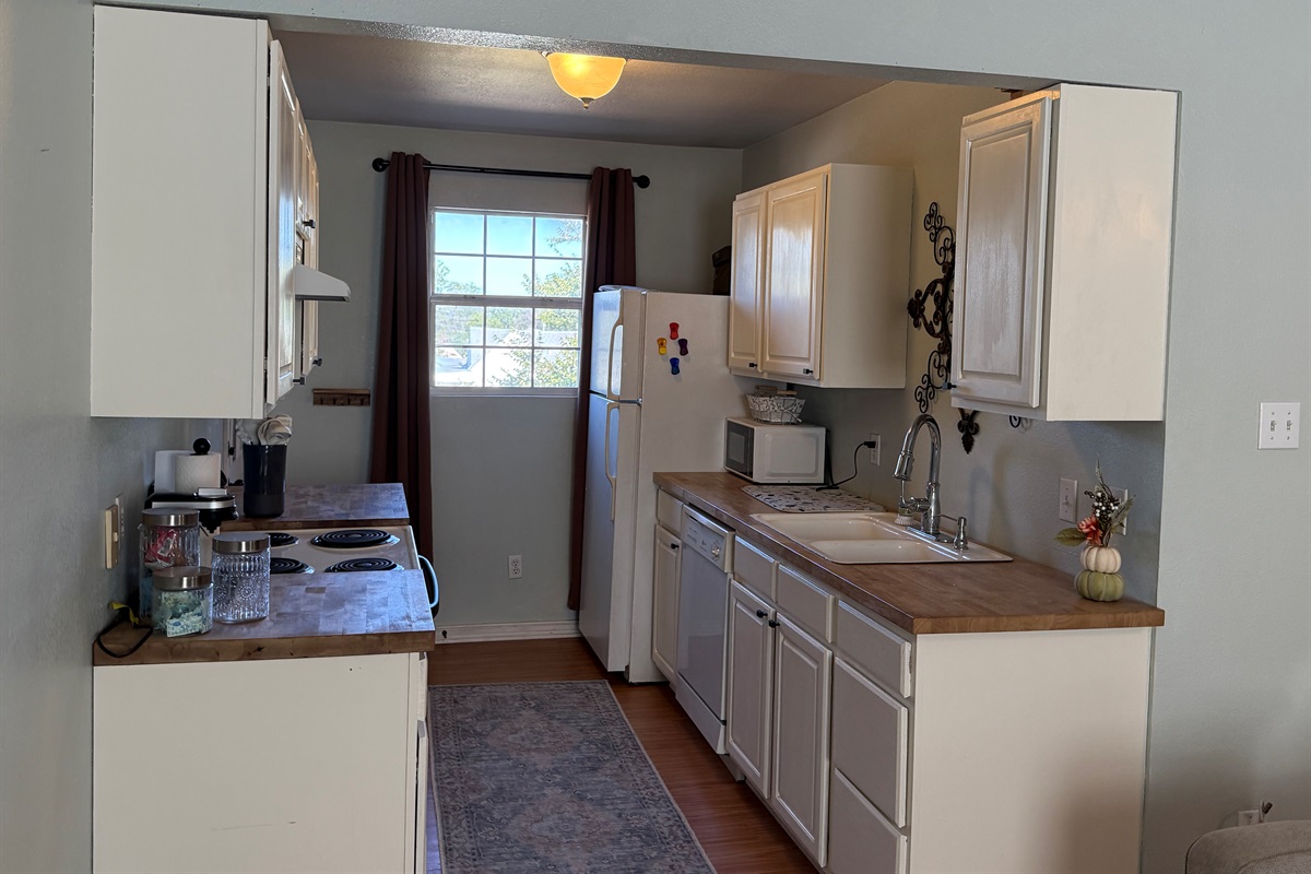 Compact kitchen perfect for light cooking.