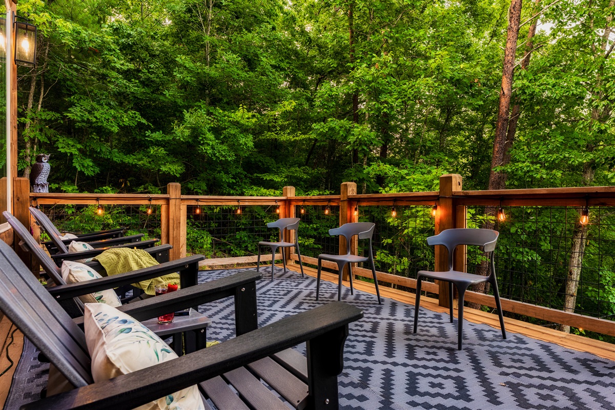 Enjoy your coffee on the rockers on the back decks with string lights