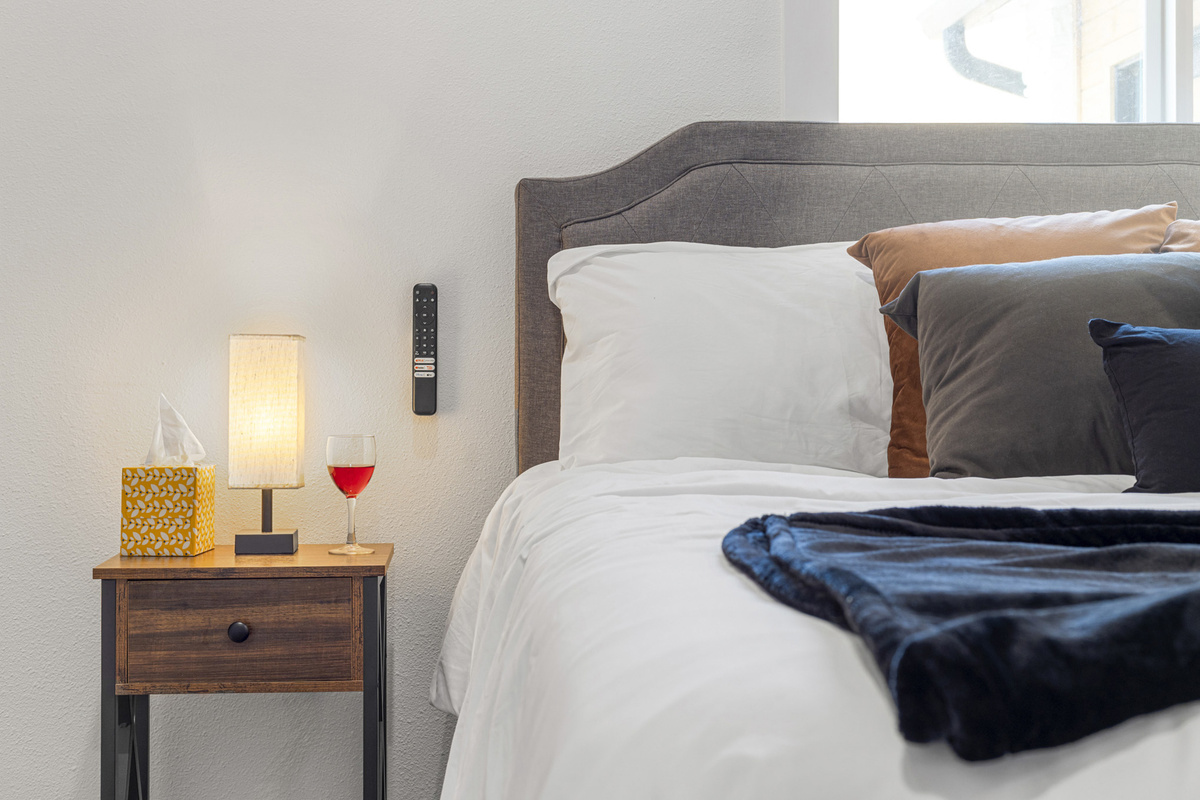 Sip a glass of wine by your stylish nightstand and unwind in comfort!