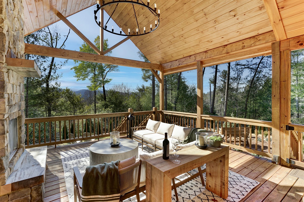 Unwind on the covered deck with cozy seating, a crackling fireplace, and endless mountain views. Perfect for morning coffee, evening wine, and everything in between.