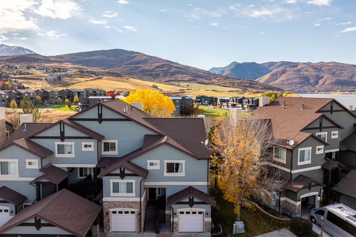 Community view with nearby mountain and lake scenery.