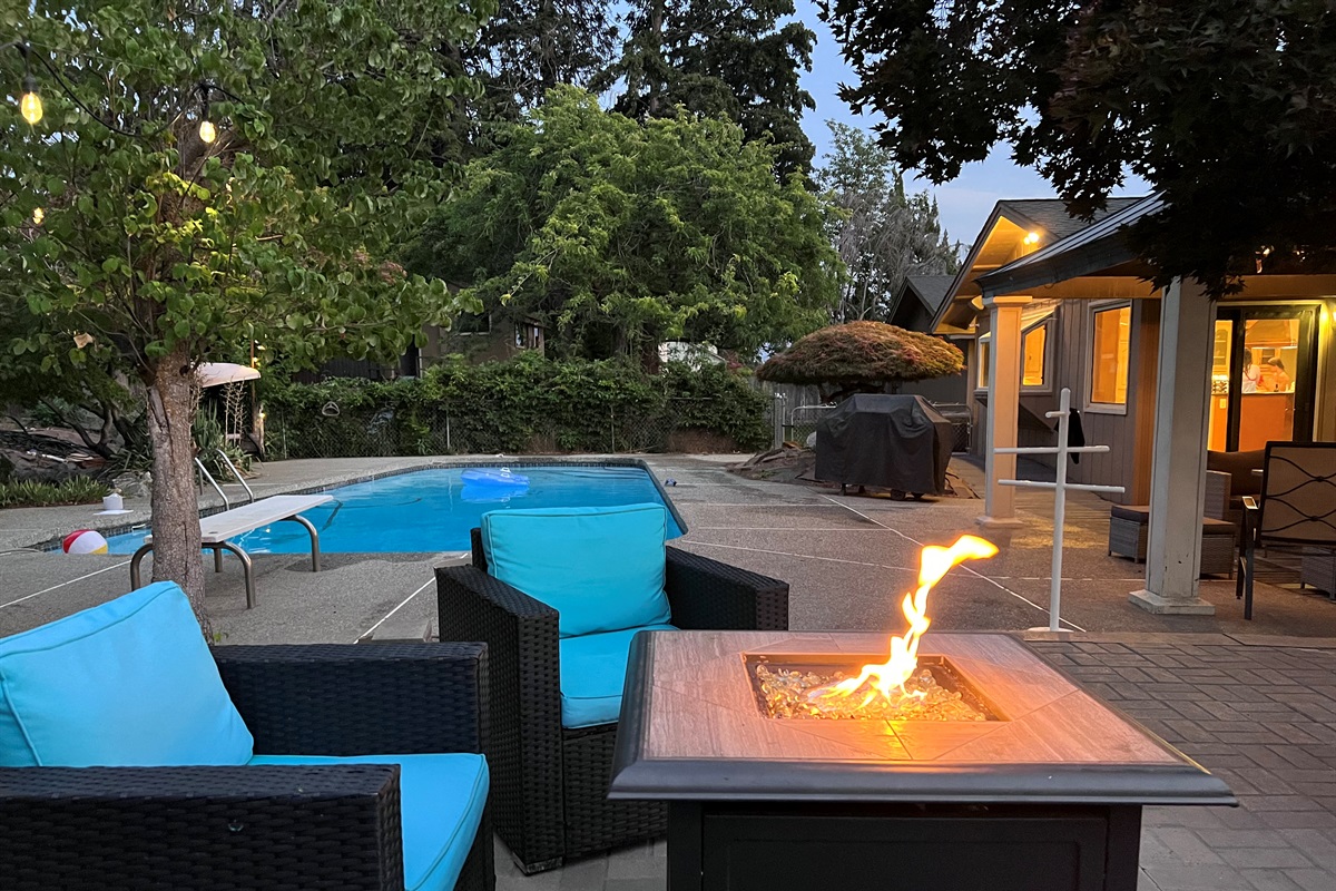 Enjoy the fire pit with family and friends, we have multiple seating areas in our private backyard.