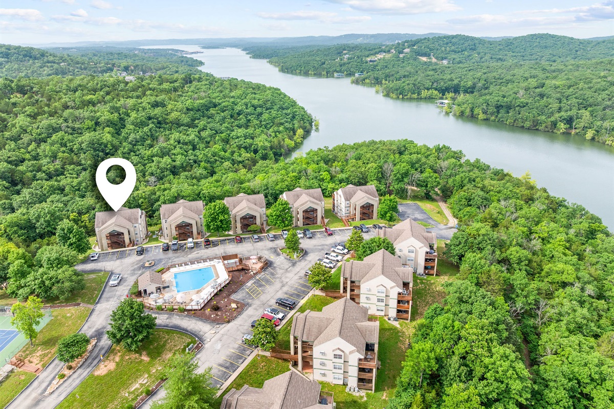 Indian Point Cove nestled along the water, offering a quiet lakeside retreat surrounded by rolling hills and dense greenery.