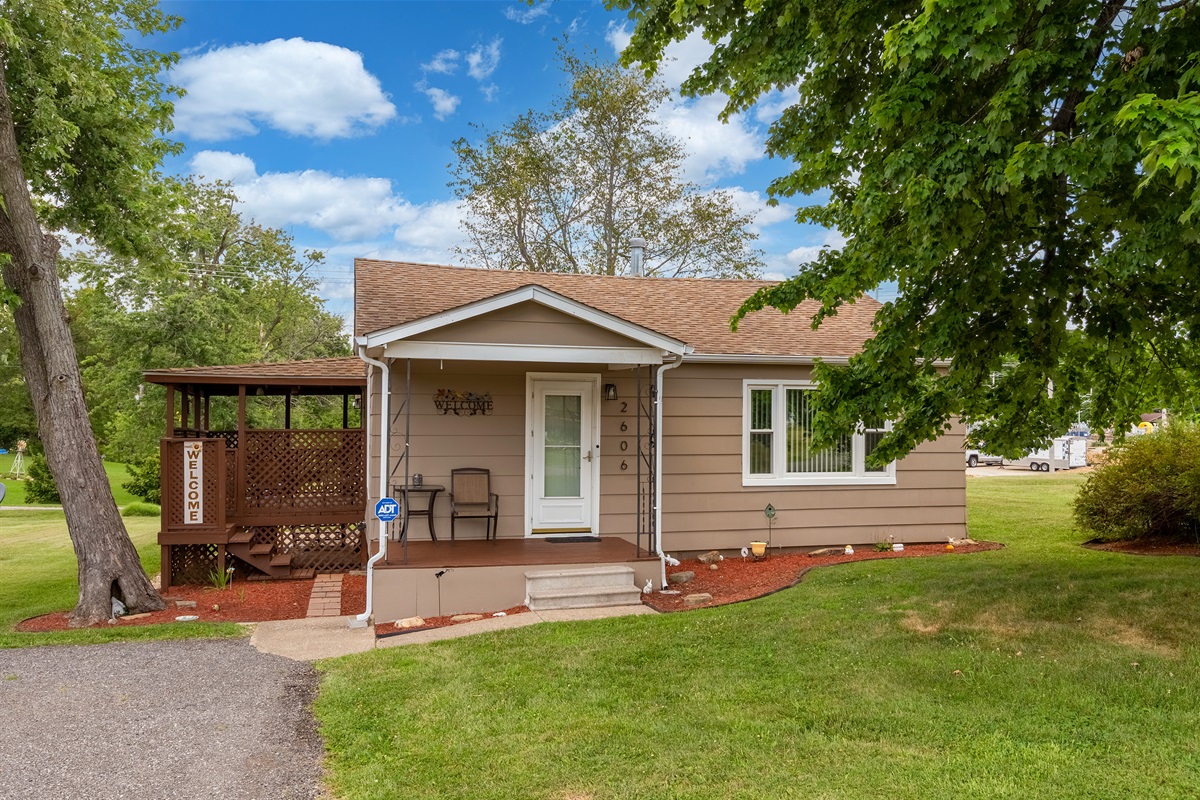 Charming curb appeal. The covered porch adds classic character to this beautifully landscaped home.