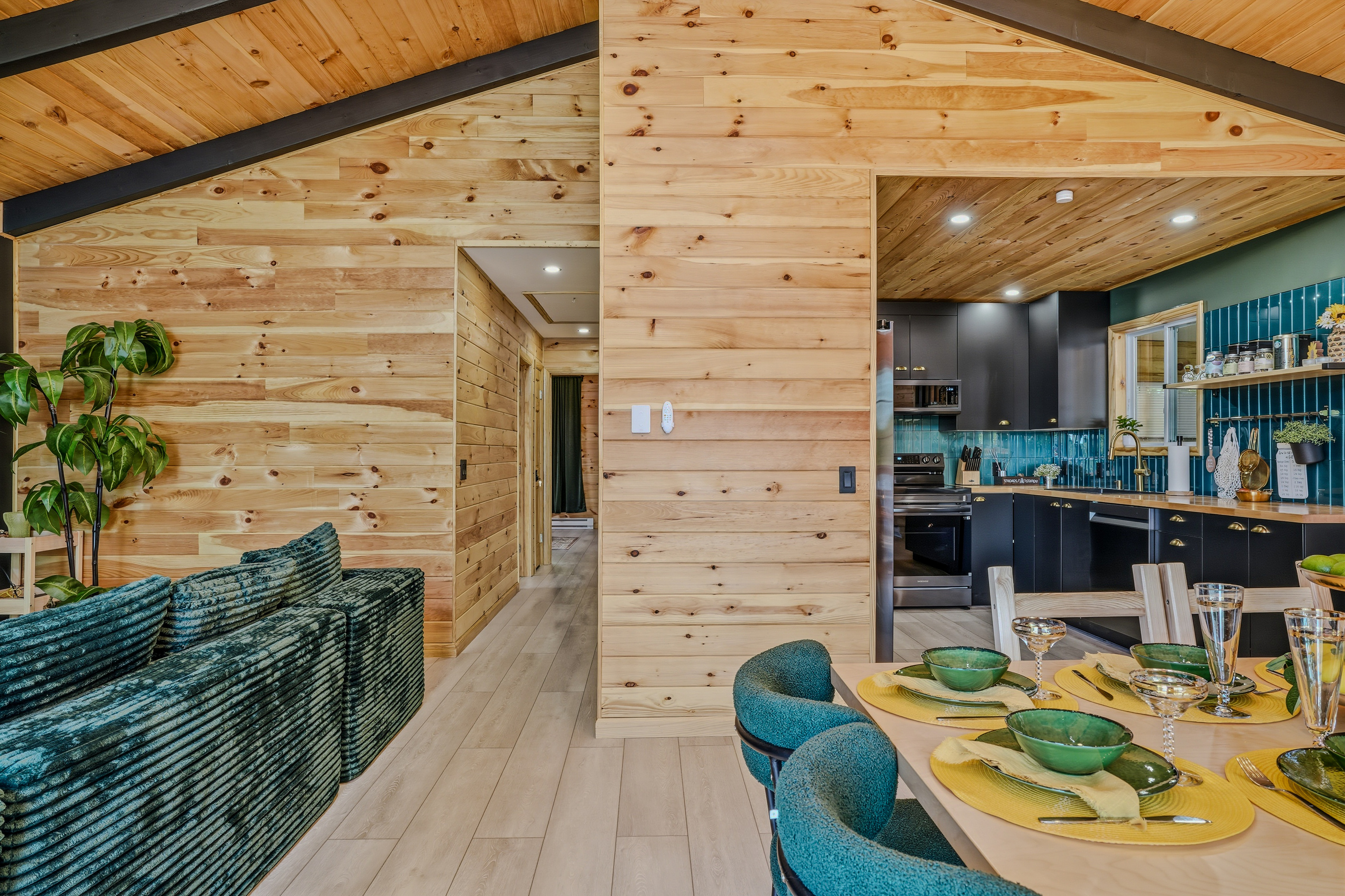 Open-concept view from upper level — living area, kitchen, and lake light beyond