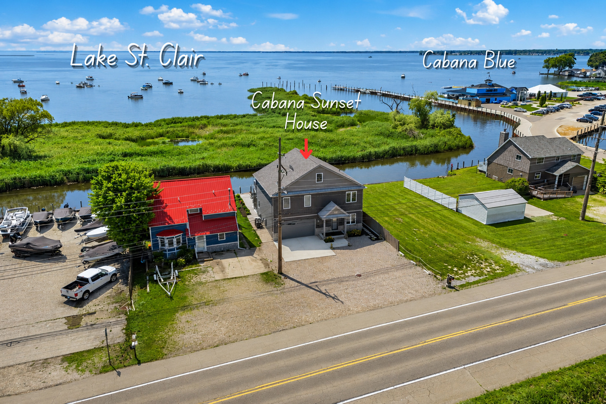 Stay in the heart of Lake St. Clair's boating scene! This waterfront home is next to Cabana Blue, a favorite waterfront restaurant and bar, with easy lake access, nearby marinas, fishing, boating, dining, and beautiful water views.