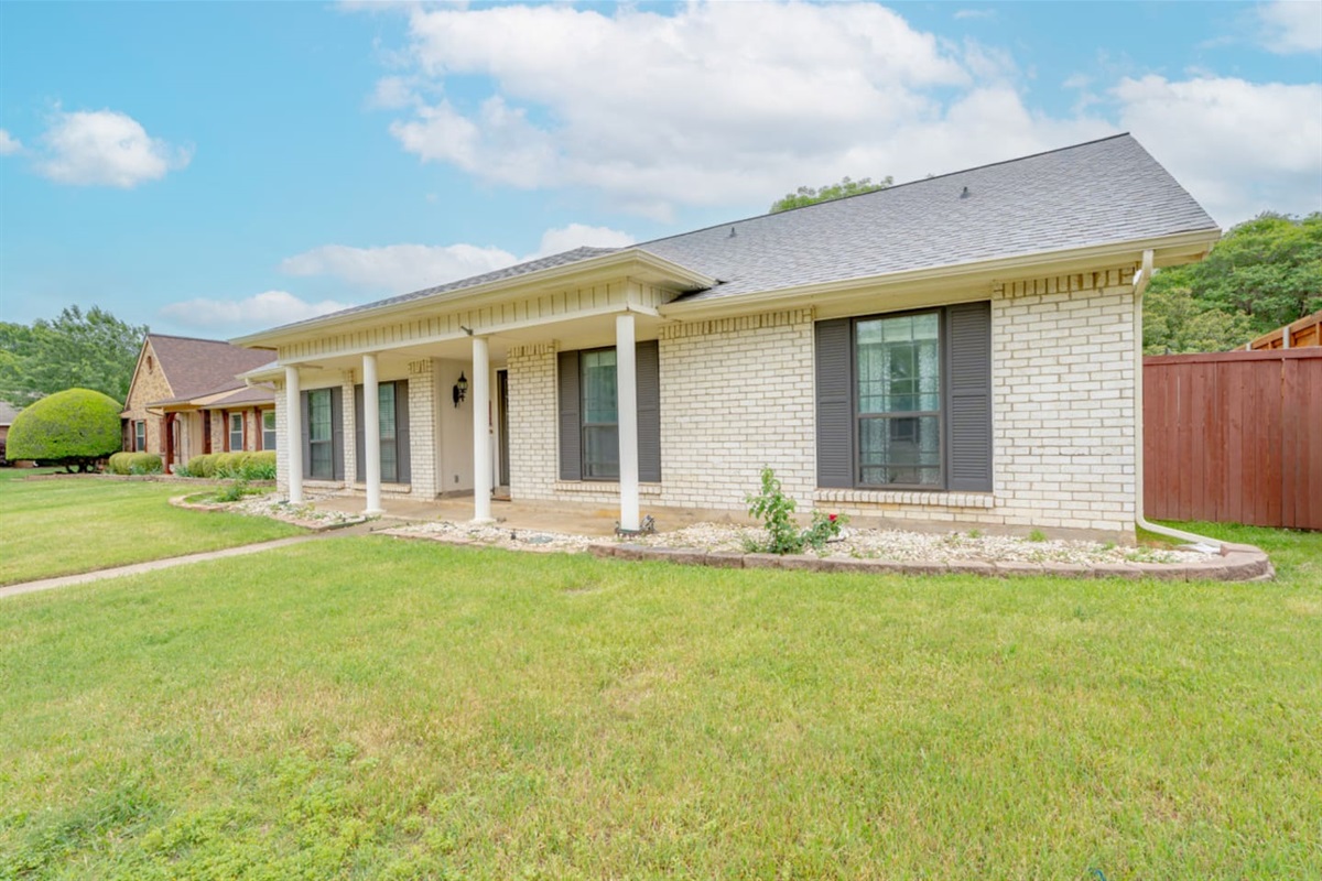 Charming brick exterior with inviting front porch.