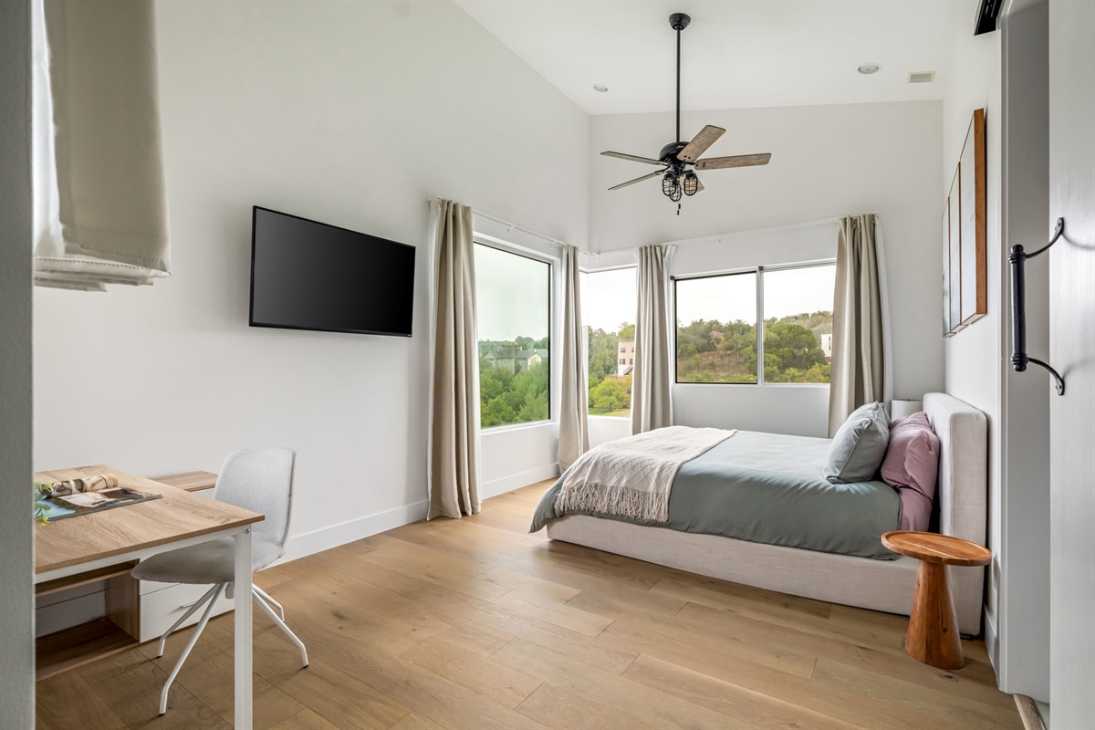 Peaceful primary bedroom with king bed and relaxing views